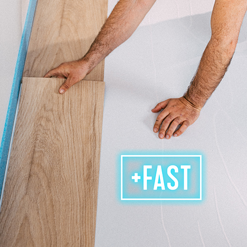 A person installing light wood laminate flooring over a white underlayment, with a glowing +FAST graphic suggesting quick installation.