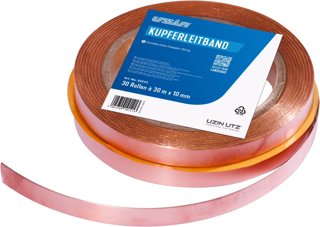 Close-up of a roll of conductive copper tape with a partially unrolled strip. The tape has a metallic reddish-copper surface and an adhesive backing protected by an orange release liner. A blue and white product label on top reads 'KUPFERLEITBAND' and shows information including '30 Rollen à 30 m x 10 mm', a barcode and brand markings. The roll sits on a white background and the copper surface reflects light, revealing its texture and sheen.